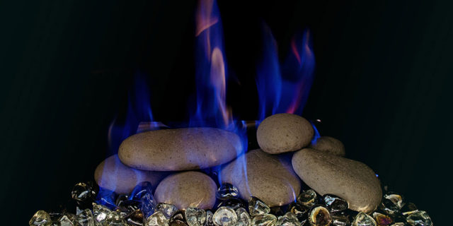 Gas fireplace with stones